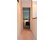 A long hallway leading to another room in the house at 2815 S Locust St # F, Denver, CO 80222