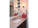 Bathroom with granite countertop, updated vanity, and stylish light fixtures at 2815 S Locust St # F, Denver, CO 80222