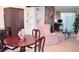 Charming dining area with wood table and chairs, adjacent to a comfortable seating area at 2815 S Locust St # F, Denver, CO 80222