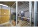 Secure storage unit with shelving for tenant's belongings at 1020 15Th St # 214, Denver, CO 80202