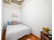 Cozy bedroom with wainscoting and hardwood floors at 1020 15Th St # 214, Denver, CO 80202