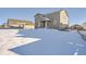 House exterior with snowy backyard at 42367 Glen Abbey Dr, Elizabeth, CO 80107