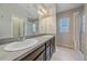 Bathroom with double vanity and shower at 15325 W 93Rd Ave, Arvada, CO 80007