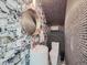 Stylish powder room with marble and dark tile accents at 1163 Vine St, Denver, CO 80206