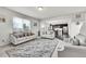 Open concept living room with view into kitchen and dining area at 207 S Irvington St, Aurora, CO 80018