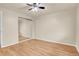 Bright bedroom with mirrored closet doors and laminate flooring at 1143 Lamar St # 3, Lakewood, CO 80214