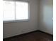 Bright bedroom with hardwood floors and window at 9105 E Lehigh Ave # 63, Denver, CO 80237