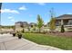 Landscaped backyard with patio, and a view of neighboring homes at 2614 Hillcroft Ln, Castle Rock, CO 80104