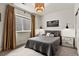 Cozy basement bedroom with gray bedding and ample closet space at 2614 Hillcroft Ln, Castle Rock, CO 80104