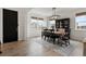 Entryway with black door and wood flooring leading to the dining area at 2614 Hillcroft Ln, Castle Rock, CO 80104