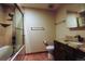 Bathroom with tiled floor, shower/tub combo, and granite vanity at 17863 E Prentice Dr, Centennial, CO 80015