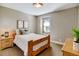 Cozy bedroom with a wooden bed frame and calming decor at 8459 Sheps Way, Broomfield, CO 80021