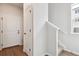 Bright foyer with white doors and staircase at 455 Interlocken Blvd # 105, Broomfield, CO 80021