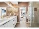 Elegant bathroom with double vanity, walk-in shower, and modern fixtures at 2343 Decatur St, Denver, CO 80211