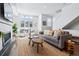 Spacious living room featuring a fireplace and ample natural light at 2343 Decatur St, Denver, CO 80211