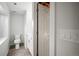 Small basement bathroom with toilet and vanity at 6690 S Sheridan Blvd, Littleton, CO 80123