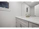 Basement bathroom with gray vanity and quartz countertop at 6690 S Sheridan Blvd, Littleton, CO 80123