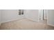 Spacious finished basement bedroom with neutral carpeting and ample natural light at 6690 S Sheridan Blvd, Littleton, CO 80123