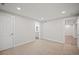 Bright basement bedroom featuring carpeting, an ensuite bathroom, and built-in closet at 6690 S Sheridan Blvd, Littleton, CO 80123