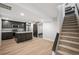 Basement kitchen with island and stainless steel appliances at 6690 S Sheridan Blvd, Littleton, CO 80123