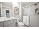 Modern bathroom with a shower and a vanity with a quartz countertop at 6690 S Sheridan Blvd, Littleton, CO 80123