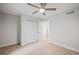Spacious bedroom with double-door closet and ceiling fan at 6690 S Sheridan Blvd, Littleton, CO 80123