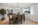 Dining room with hardwood floors and view to kitchen at 6690 S Sheridan Blvd, Littleton, CO 80123