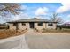 Ranch style home with a landscaped front yard at 6690 S Sheridan Blvd, Littleton, CO 80123