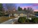 Brick ranch home with landscaped yard and large driveway at 6690 S Sheridan Blvd, Littleton, CO 80123