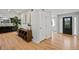 Light and airy hallway with hardwood floors at 6690 S Sheridan Blvd, Littleton, CO 80123