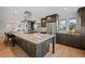 Spacious kitchen with stainless steel appliances and granite island at 6690 S Sheridan Blvd, Littleton, CO 80123