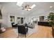 Open living room with hardwood floors and access to backyard at 6690 S Sheridan Blvd, Littleton, CO 80123