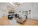 Open living room with hardwood floors and a modern fireplace at 6690 S Sheridan Blvd, Littleton, CO 80123