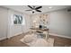 Home office with hardwood floors and large artwork at 6690 S Sheridan Blvd, Littleton, CO 80123
