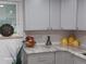 Kitchen counter with granite countertop and hexagon tile backsplash at 2635 S Josephine St, Denver, CO 80210