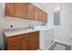 Laundry room with washer, dryer, and ample cabinet storage at 8547 Gold Peak Dr # G, Highlands Ranch, CO 80130