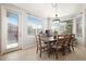 Bright dining room with table and chairs, and access to patio at 8547 Gold Peak Dr # G, Highlands Ranch, CO 80130