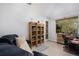 Bright home office features built-in shelving, and access to a private balcony at 8547 Gold Peak Dr # G, Highlands Ranch, CO 80130