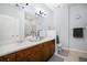 Elegant bathroom boasts dual vanities, a large shower, and plenty of counter space at 8547 Gold Peak Dr # G, Highlands Ranch, CO 80130