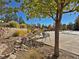 Landscaped pool area with stonework and seating at 8547 Gold Peak Dr # G, Highlands Ranch, CO 80130