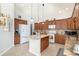Spacious kitchen with an island, granite countertops, and ample cabinetry at 8547 Gold Peak Dr # G, Highlands Ranch, CO 80130