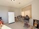 Multi-purpose room with a vintage barber chair and refrigerator at 8547 Gold Peak Dr # G, Highlands Ranch, CO 80130