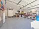 Spacious garage with various storage solutions and a workshop at 8547 Gold Peak Dr # G, Highlands Ranch, CO 80130