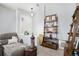 Welcoming entryway with decorative shelving and comfortable seating at 8547 Gold Peak Dr # G, Highlands Ranch, CO 80130