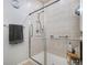 Clean shower with glass enclosure and grab bars at 8547 Gold Peak Dr # G, Highlands Ranch, CO 80130