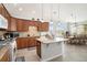 Open kitchen with an island, granite countertops, and stainless steel appliances at 8547 Gold Peak Dr # G, Highlands Ranch, CO 80130
