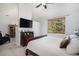 Main bedroom with king-size bed, window seat and private access to balcony at 8547 Gold Peak Dr # G, Highlands Ranch, CO 80130