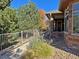 Landscaped yard with walkway and stone accents near the home entrance at 8547 Gold Peak Dr # G, Highlands Ranch, CO 80130