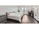 Bright bedroom with two twin beds, balcony access, and a desk at 7587 Wright Ct, Arvada, CO 80005