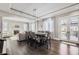 Open concept dining area with hardwood floors, fireplace, and access to backyard patio at 7587 Wright Ct, Arvada, CO 80005